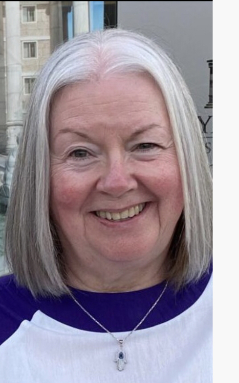 head shot of smiling Yvonne with lovely white bobbed hair